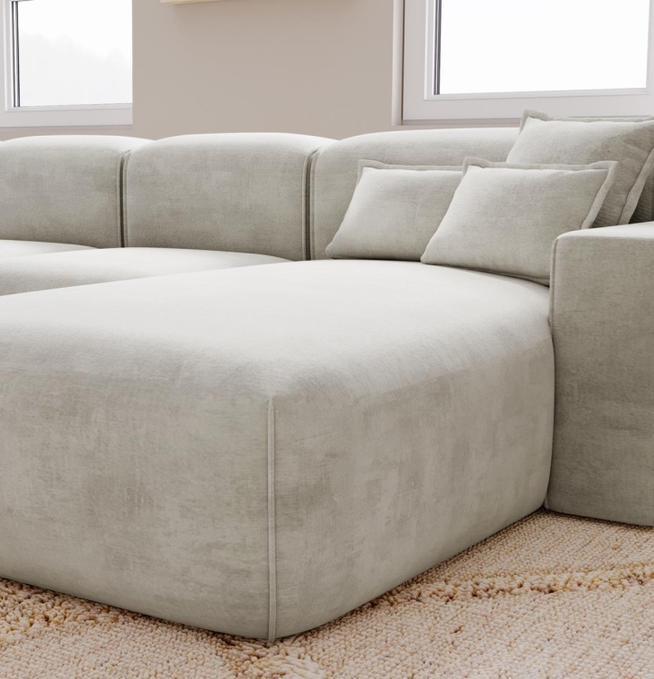 Tapicerowany jasny narożnik w szarym kolorze do dużego salonu AURIA